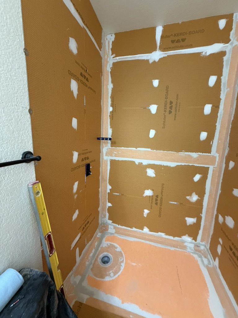 Schluter KERDI-BOARD shower walls with sealed niche before tile